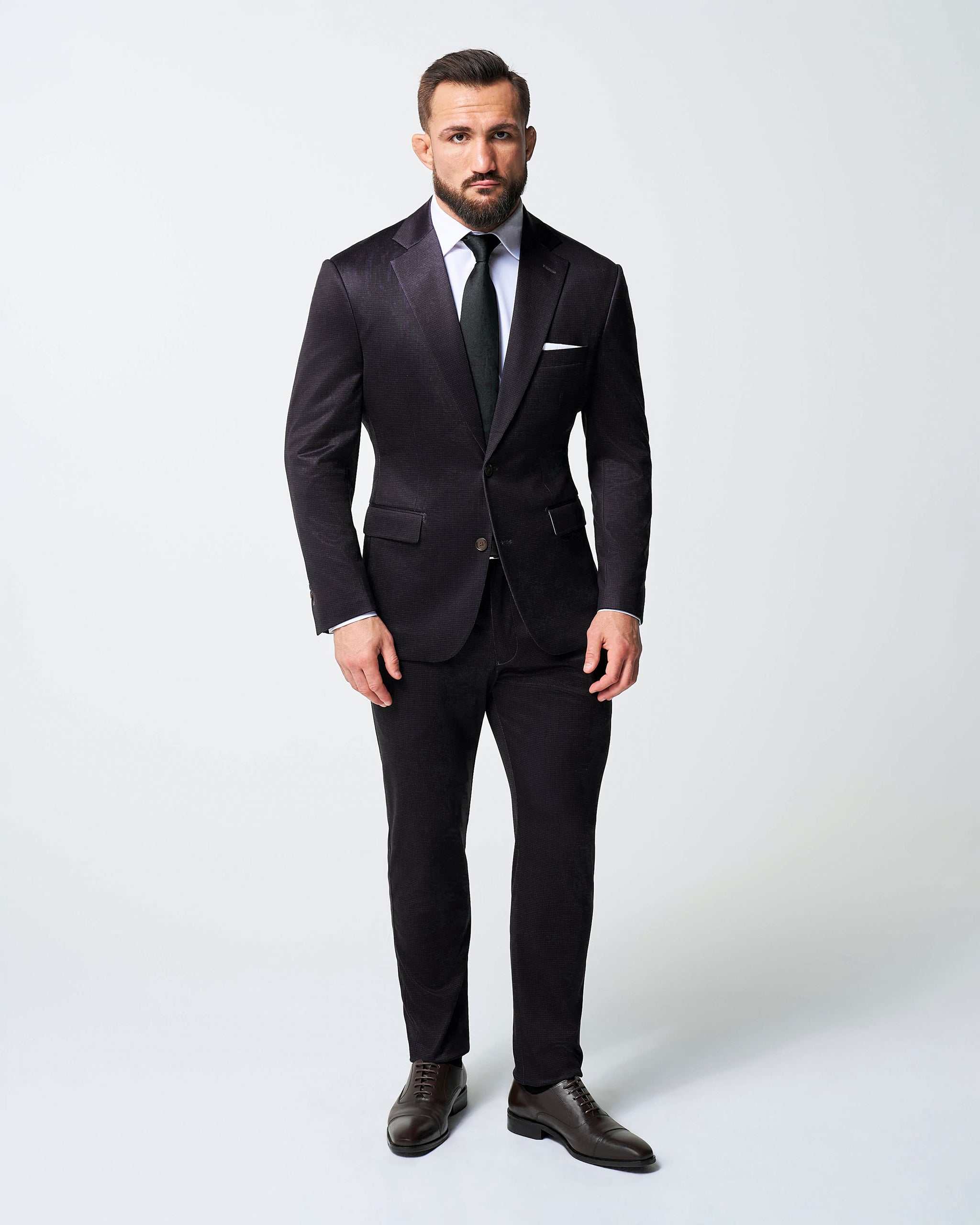 burgundy dress shirt with suit The outfit features a classic navy suit with a pink shirt, burgundy foulard tie with subtle detailing, and burgundy dress boots